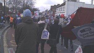 Protest march against academy plan