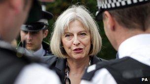 Home secretary with police officers