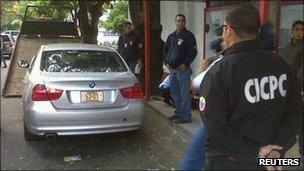 Police inspect the Mexican ambassador's car in Caracas