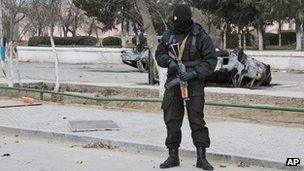 Kazakh riot police officer patrols in centre of Zhanaozen, Kazakhstan (17 Dec 2011)