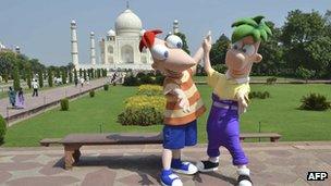 Disney cartoon characters Phineas and Ferb pose in front of The Taj Mahal