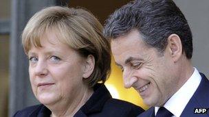 German Chancellor Angela Merkel (left) with French President Nicolas Sarkozy in Paris, 5 December 2011