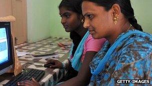 Indian women in front of a computer