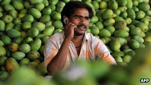 An Indian farmer talking on his mobile phone