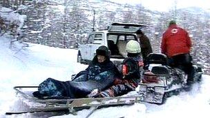 An elderly man is transferred to an ambulance in central Serbia (2 Feb 2012)