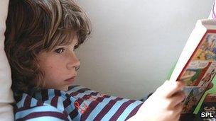 Generic image of boy reading book