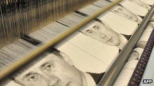 Images of Vladimir Putin are woven on a loom near St Petersburg