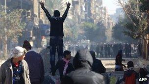 Barricade erected by protesters facing riot police near Cairo's Tahrir Square on 5 February 2012