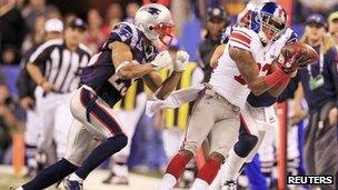 Mario Manningham of the New York Giants catches a key throw and helps secure the team's victory against the New England Patriots in the 2012 Super Bowl 5 February 2012