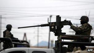 Soldiers patrol a street in Monterrey