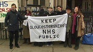 Campaigners against NHS Gloucestershire's plans arrive at the High Court in London