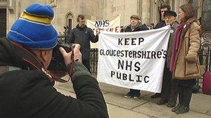 Campaigners against NHS Gloucestershire's plans arrive at the High Court in London