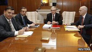 Greek party leaders, from left, George Karatzaferis, Antonis Samaras, Prime Minister Lucas Papademos and George Papandreou at the prime minister's office in Athens (8 Feb 2012)