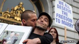 A gay couple kiss after a court in California declared the state's ban on gay marriage was unconstitutional 7 February 2012