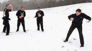 England players Ben Foden, Tom Croft, Chris Robshaw and Dylan Hartley pelt Ronan Dunne of O2