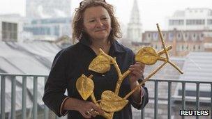 Rachel Whiteread with a model of her bronze and gold-leaf commission for the Whitechapel Gallery