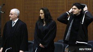 Arid Uka (R) with legal team in court in Frankfurt (January 9, 2012)