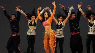 Indian film actress Malika Arora (3rd L) dances during in the inaugural ceremony of the Bangladesh Premier League (BPL) at Sher-e-Bangla National Cricket Stadium in Dhaka on February 9 , 2012