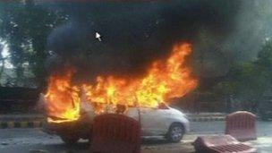 Grab from Indian TV showing burning car outside Israeli embassy in Delhi, India - 13 February 2012