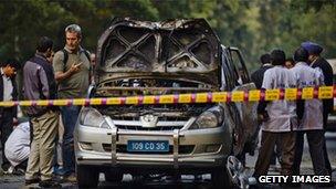 Police inspect the wrecked Israeli embassy vehicle, 13 Feb