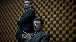 Still from Tinker Tailor Soldier Spy with Gary Oldman and John Hurt (seated)