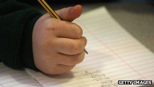 A child writing in a school book