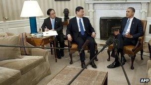 US President Barack Obama and Chinese Vice President Xi Jinping speak during meetings in the Oval Office Washington, DC, 14 February 2012