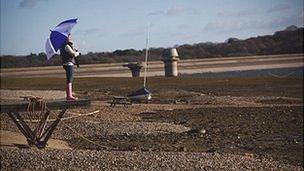 Person with umbrella at Bewl Water