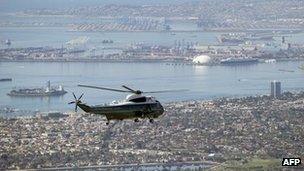 The White House helicopter Marine One with US President Barack Obama aboard flies over Long Beach, California, on Thursday