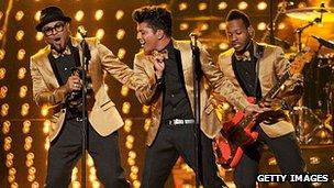 Bruno Mars (centre) and his band