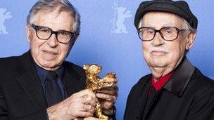 Italian directors Vittorio (R) and Paolo Taviani receive the Golden Bear prize awarded for their film "Caesar Must Die