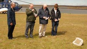 The Jones family at the memorial on Craig Island