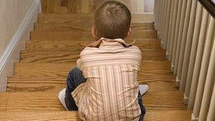 Boy sitting on stairs