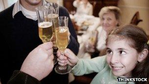 Child joining in a family toast