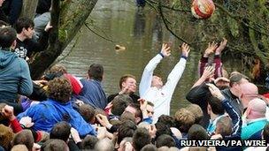 Players during the Royal Shrovetide Football match in Ashbourne, Derbyshire