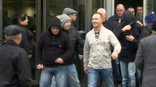 Some of the acquitted men and their supporters leaving court after the verdicts