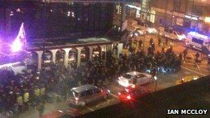 Fans and police on Deansgate