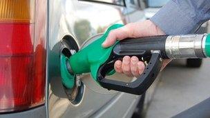 A man filling his car with petrol