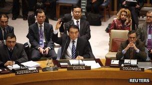 Chinese Ambassador to the United Nations Li Baodong votes to block a Security Council resolution backing an Arab League call for Syrian President Bashar Assad to step down, at UN headquarters on 4 February 2012