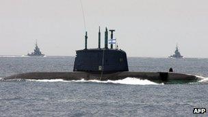 Escorted by navy missile ships, Israeli submarine 'Dolphin' sails along the Mediterranean Sea near the coastal city of Tel Aviv during special naval maneuvers ahead of Israel?s 60th independence anniversary on May 5, 2008. The 'Dolphin', a German-built submarine, is 56.4m long with a cruising range of 4500 nautical miles. It is armed with ten 21-inch multi-purpose tubes for torpedoes, mines, missiles and decoys.
