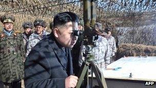 Undated image from KCNA news agency shows Kim Jong-un inspecting a military unit