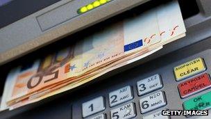 Euro notes being dispensed at an ATM