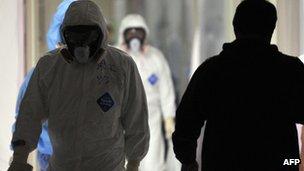 Workers at the Fukushima nuclear power plant's emergency operation centre