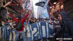 Students and the unemployed take part in a protest against austerity cuts and lack of jobs in Naples