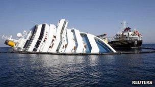 An oil tanker Elba and oil recovery sea platform near the Costa Concordia