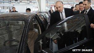 Bulgarian Prime Minister Boyko Borisov inspects a car at the GWM plant in Bahovitsa
