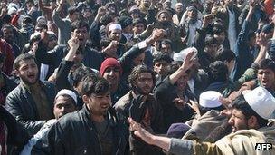 People attack a UN compound in Afghanistan in protest of Koran desecration 25 February 2012