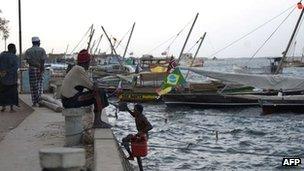 Fisherman seated at a moor in Kenya's resort island of Lamu, 28 February 2012