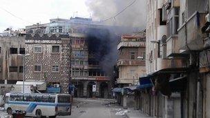 Smoke rising from building in Homs