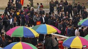 Villagers queue up at a polling station in Wukan